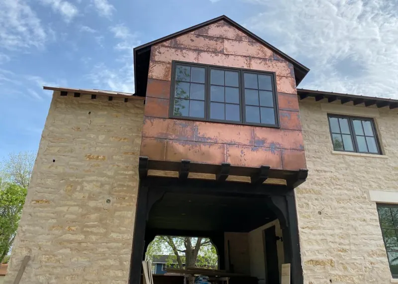 Copper metal panel facade on a stone building for Skylight Installation in Souderton